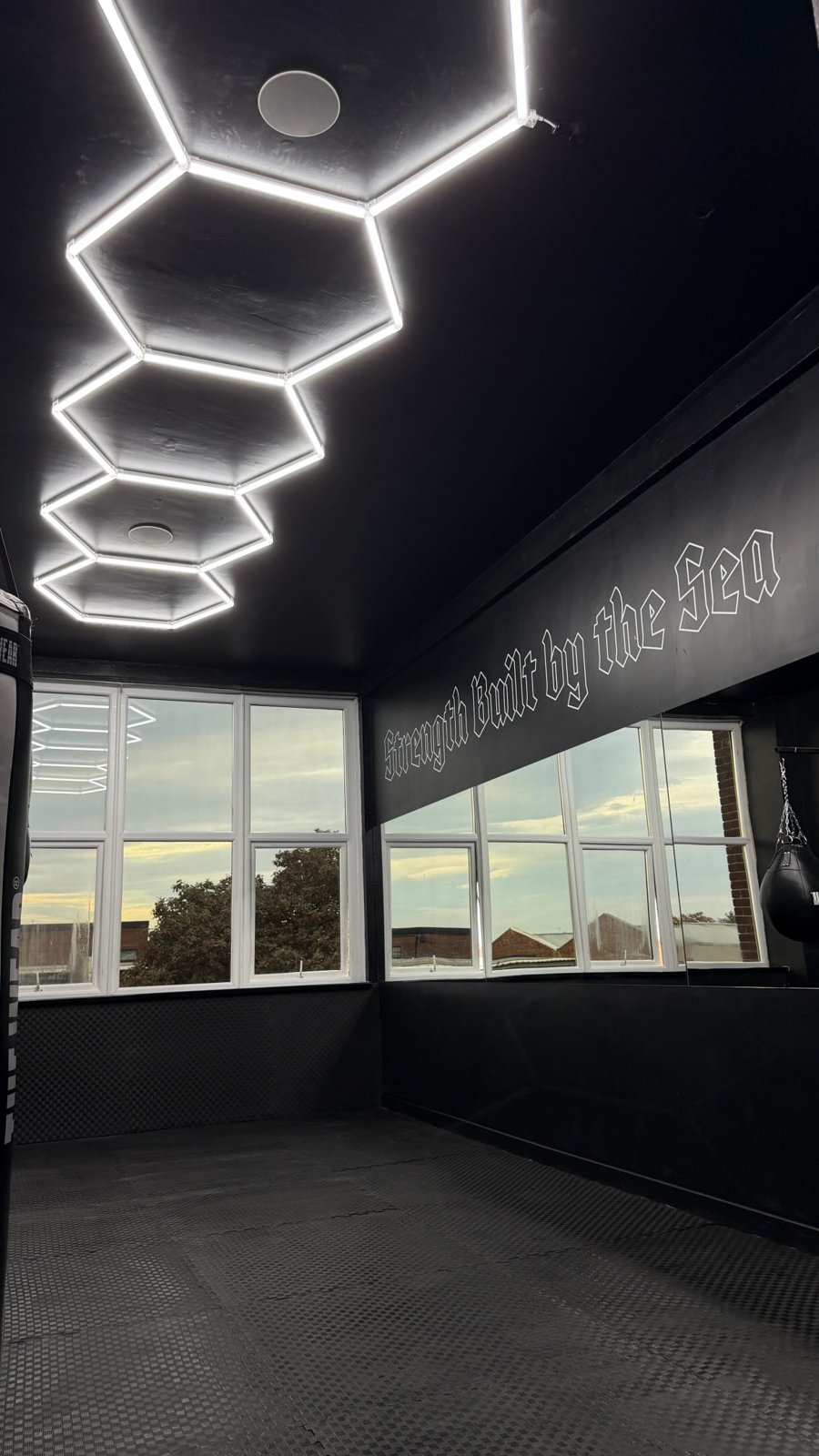 Hexagon LED lights on the boxing room ceiling