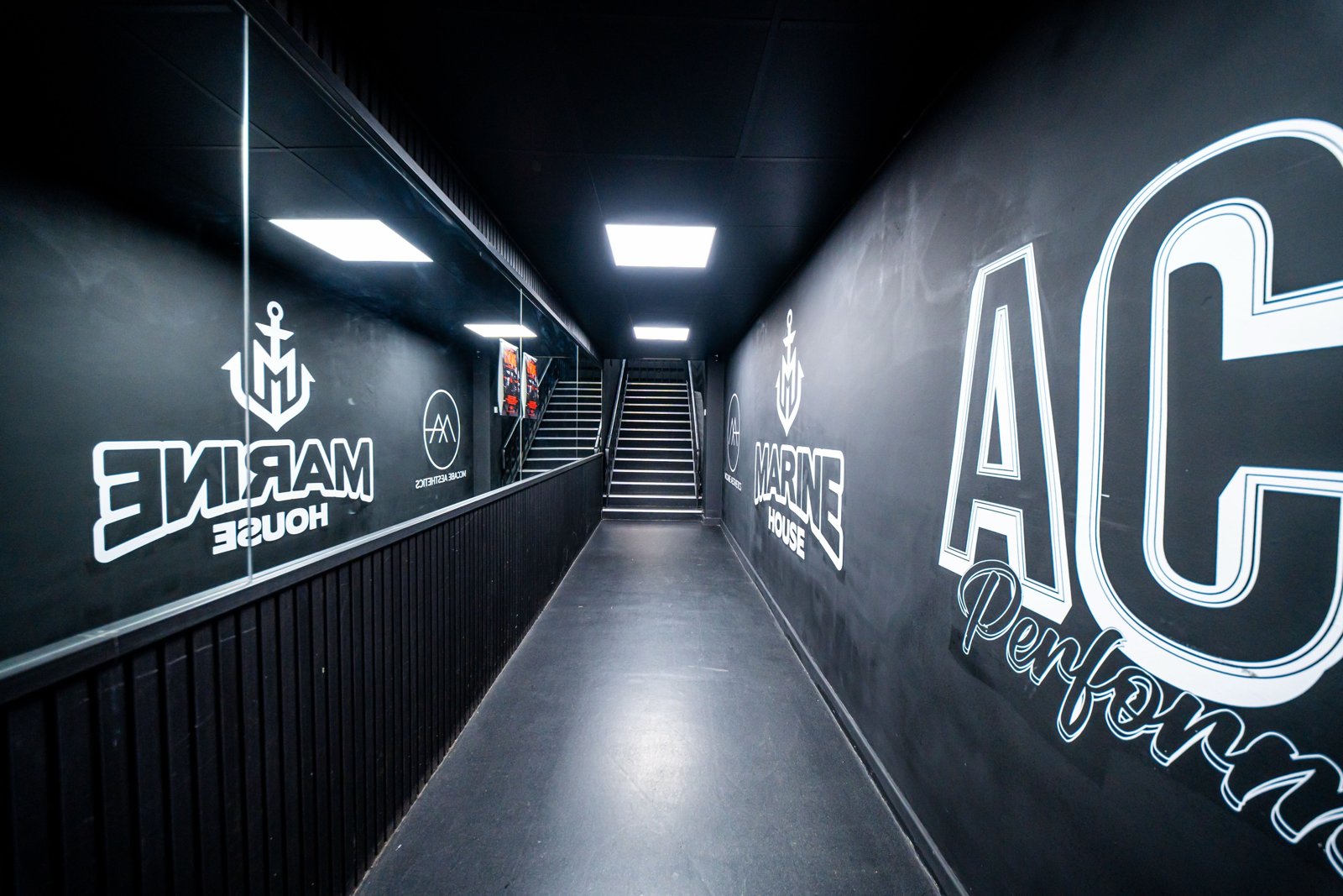 Corridor with Marine House and Ace Performers wall murals